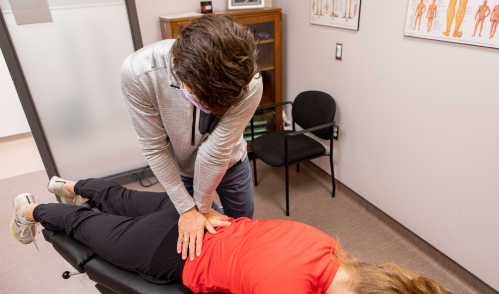 HPC Guelph Chiropractor Treating female hockey player for Lower Back Pain 